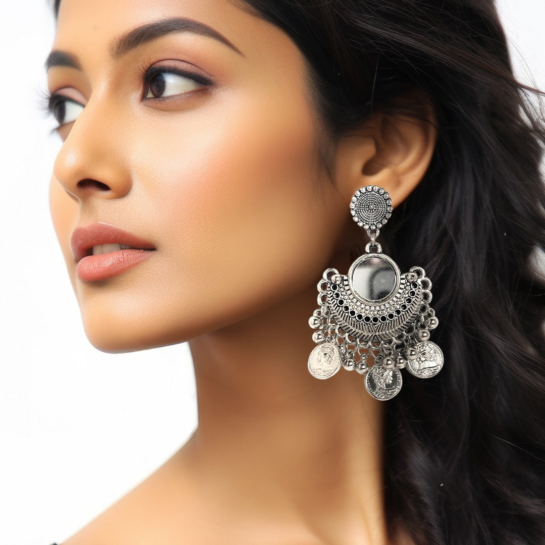 Pair of teardrop-shaped earrings with colorful hand-painted floral designs on white background