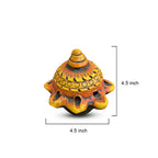 Decorative turtle figurine with measurements on a white background