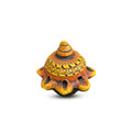 Decorative turtle figurine with orange and black pattern on a white background