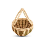 Woven basket with a handle on a white background
