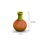 Ceramic vase with green top and orange body, shown with measurements on a white background