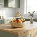 Woven fruit basket with fruits on a kitchen counter
