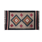 Woven rug with geometric pattern on a plain background