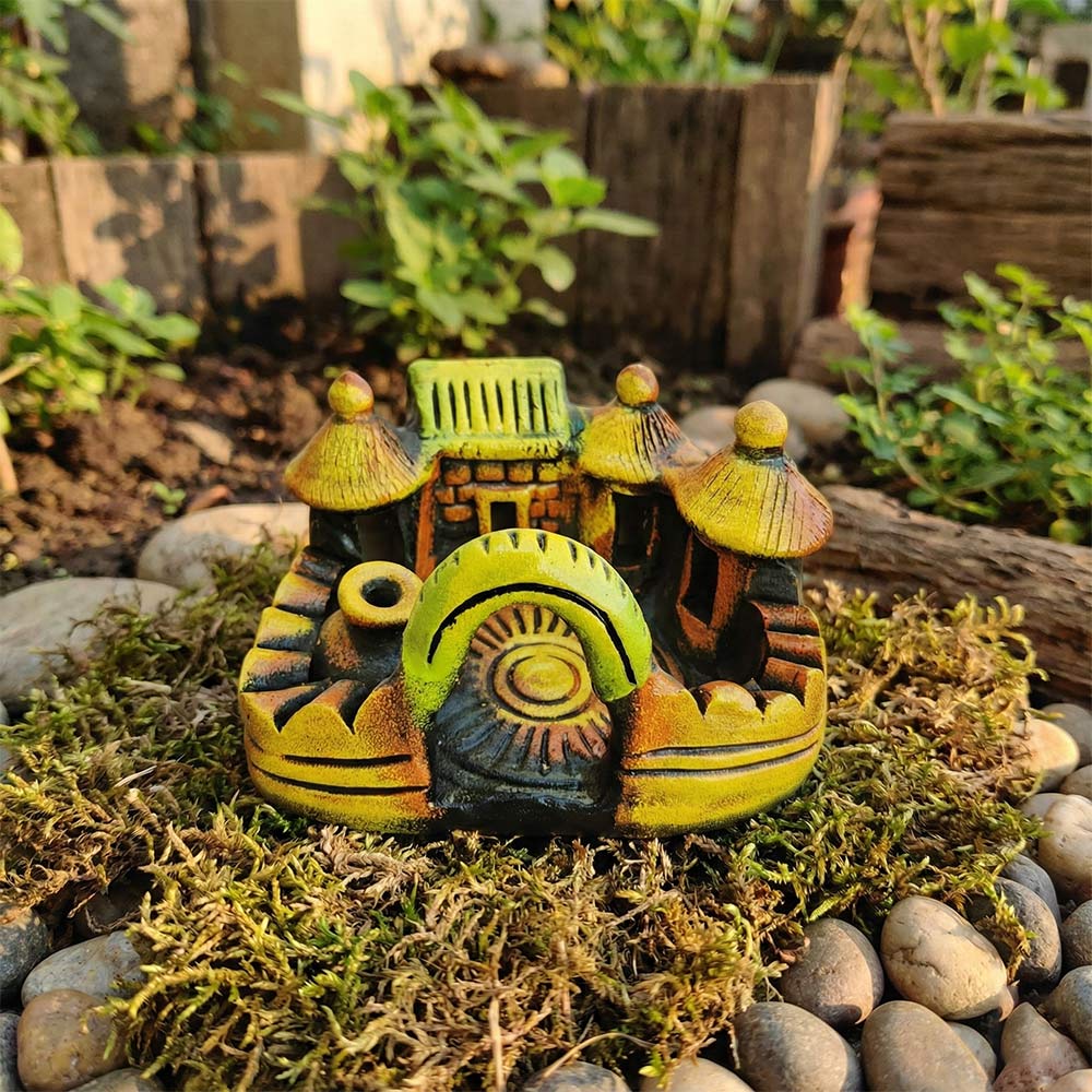 Decorative miniature village on a bed of moss and stones