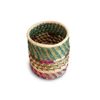 Woven basket with multicolor pattern on a white background