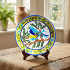 Decorative ceramic plate with a bird design on a wooden stand in a home setting.