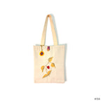 Tote bag with floral design on a white background
