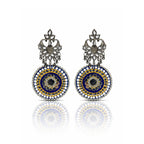 Pair of ornate earrings with blue and gold circular designs on a white background