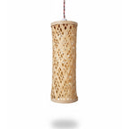 Woven wooden pendant light on a white background