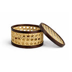 Woven basket with wooden lid on a white background
