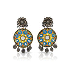 Pair of decorative earrings with floral design on a white background