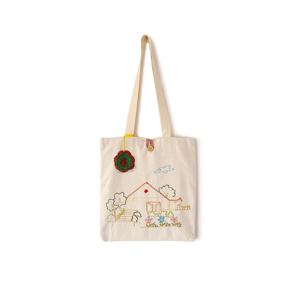 Tote bag with embroidered design on a white background