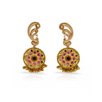Pair of golden earrings with intricate designs on a white background