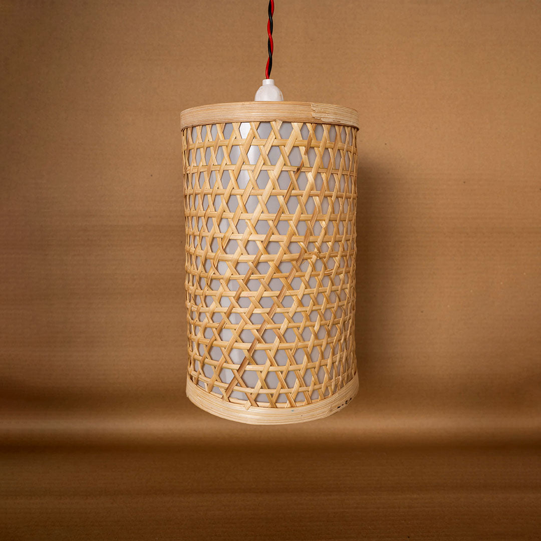 Woven rattan pendant light on a brown background
