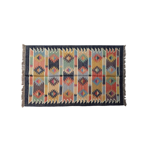 Woven rug with geometric pattern on a white background