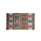 Woven rug with geometric pattern on a white background
