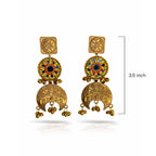 Golden earrings with colorful gemstones and intricate designs on a white background