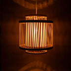 Wooden pendant lamp with a warm glow on a dark background
