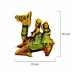 Colorful figurine of a camel with two riders, showing dimensions on a white background.
