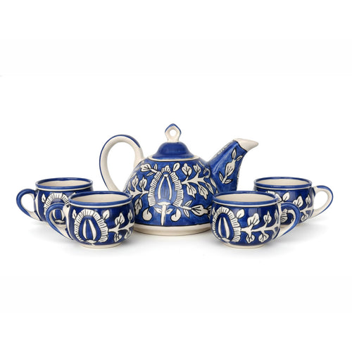 Ceramic tea set with blue and white design on a white background