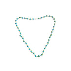 Turquoise beaded necklace on a white background