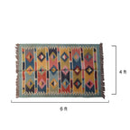 Multicolored patterned rug with dimensions 6 ft by 4 ft 