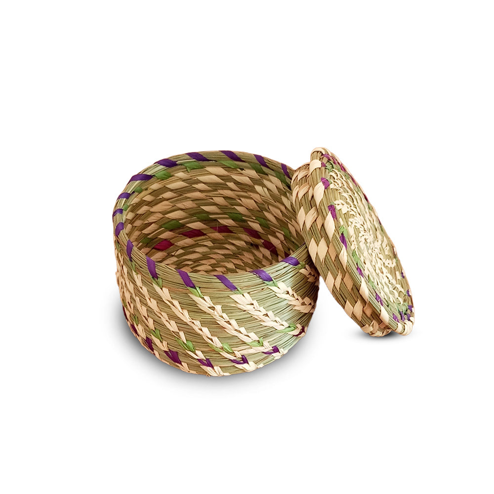 Woven basket with a lid on a white background