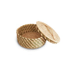 Woven basket with a lid on a white background