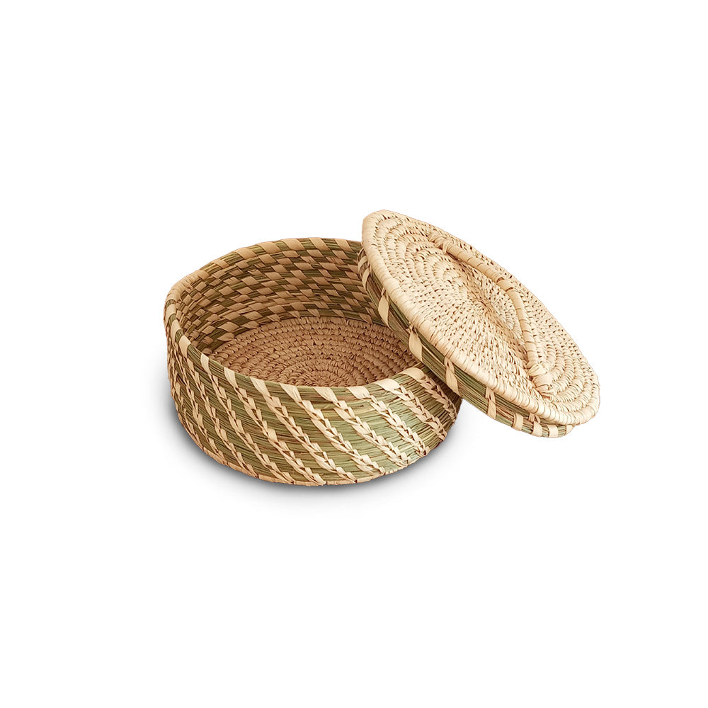 Woven basket with a lid on a white background