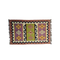 Woven rug with geometric pattern on a white background