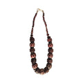Necklace with brown and red beads on a white background