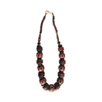 Necklace with brown and red beads on a white background