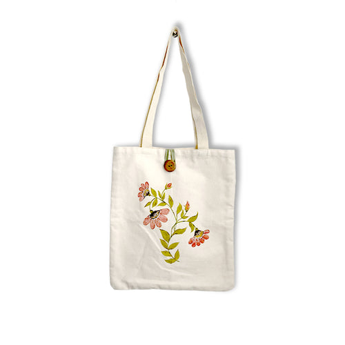 Tote bag with floral design on a white background