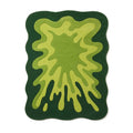 Top-down view of a vibrant green abstract splatter shape New Zealand wool rug.
