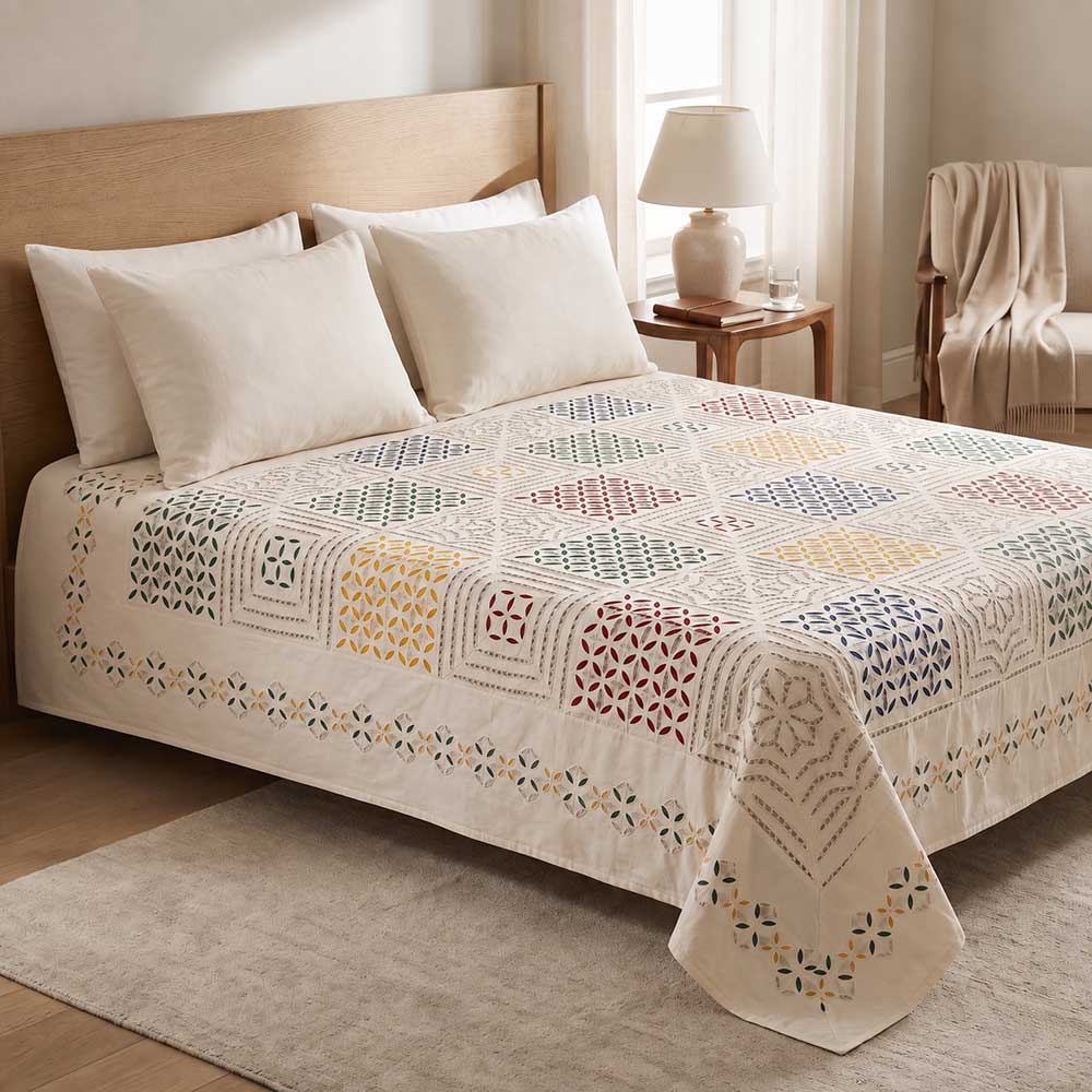 Angled view showing texture and fabric quality of the handmade applique bedspread