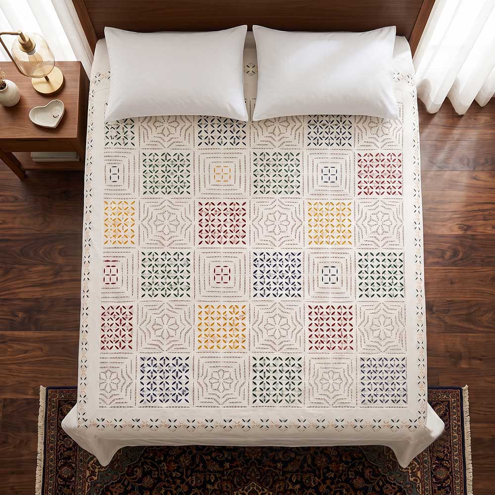 Corner detail of applique cotton bedsheet showing border and stitch work