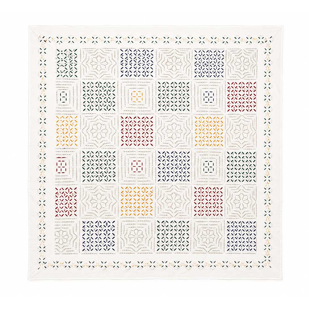 Artisan applique cotton bedspread with geometric hand-stitched patterns, front view