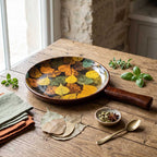 Artisan mango wood tray in use on a modern dining setting showing the scale and vibrant fall foliage design.