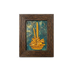Front view of an artisan stone painting featuring a golden floral relief on a teal textured background in a dark wooden frame.