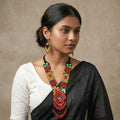 Close-up of the matching bohemian beaded fringe earrings.
