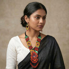 Close-up of the matching bohemian beaded fringe earrings.