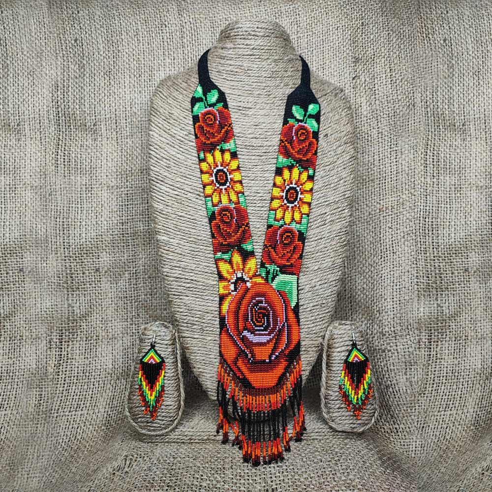 Side angle view of the beaded jewelry set on a display form.