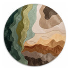 A premium round hand-tufted rug from Bhadohi Carpets featuring an organic abstract landscape pattern in shades of green, brown, and cream, shot from a direct top-down angle.