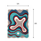 Close-up detail of the hand-tufted wool texture and color transition on the abstract designer rug.