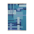 Blue geometric patterned rug on a white background