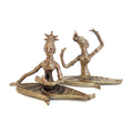 Bronze sculpture of two dancers on a white background
