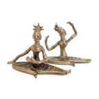 Bronze sculpture of two dancers on a white background