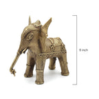 Bronze elephant figurine with decorative patterns on a white background