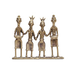 Bronze sculpture of four figures holding hands on a white background