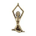 Bronze statue of a person in a yoga pose on a white background